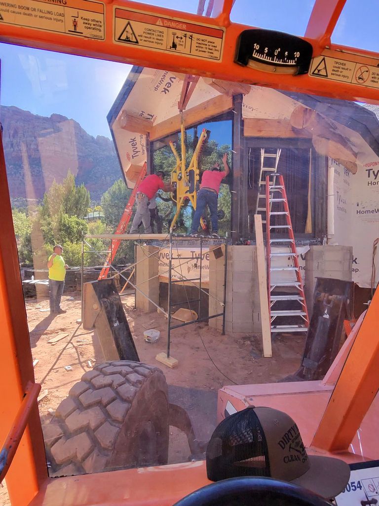 Proud Hammer Homes crew working on a log-style structure